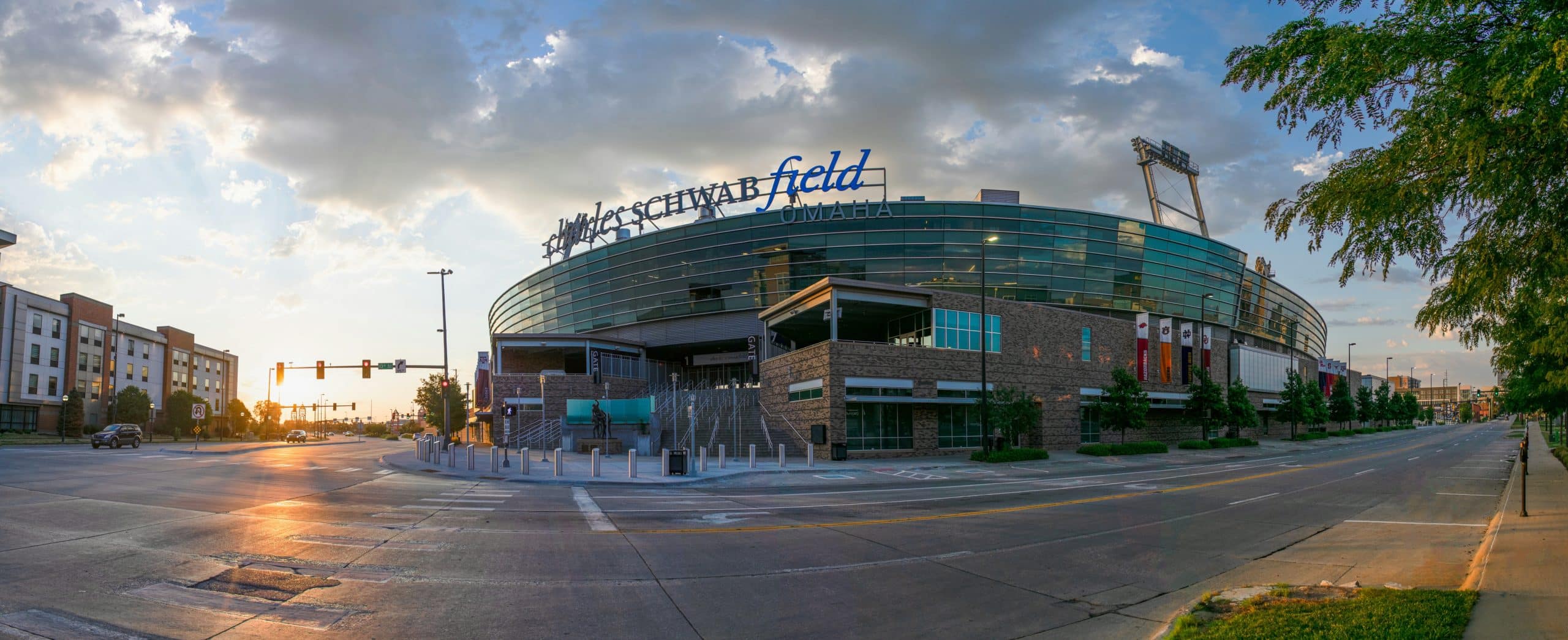 Exterior of Charles Schwab Field, an Omaha baseball stadium, at sunrise